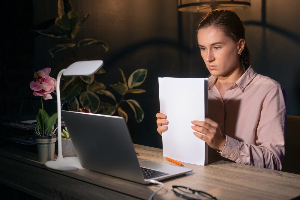 female student checking ai detection on her laptop