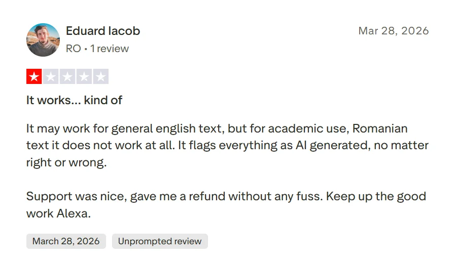 One-star Trustpilot review alleging that comma changes affected Originality AI scores on human-written content.